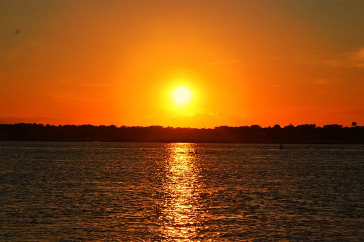 a sunset over a body of water