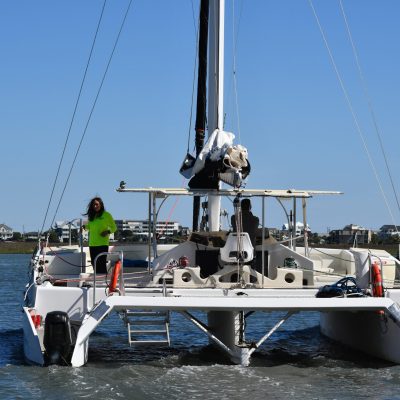 a group of people on a boat in a body of water